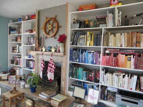 a wall of books, many of them mysteries.  (Of course, I had to recommend the Seaside Knitters series.)